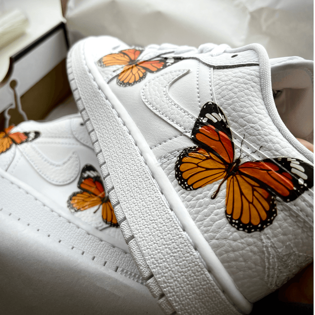 custom Butterfly jordan 1 low , custom jordan low , the custom movment custom shoes , customised trainers , customise your own sneakers , custom sneakers , custom jordans , orange butterfly design nike shoes